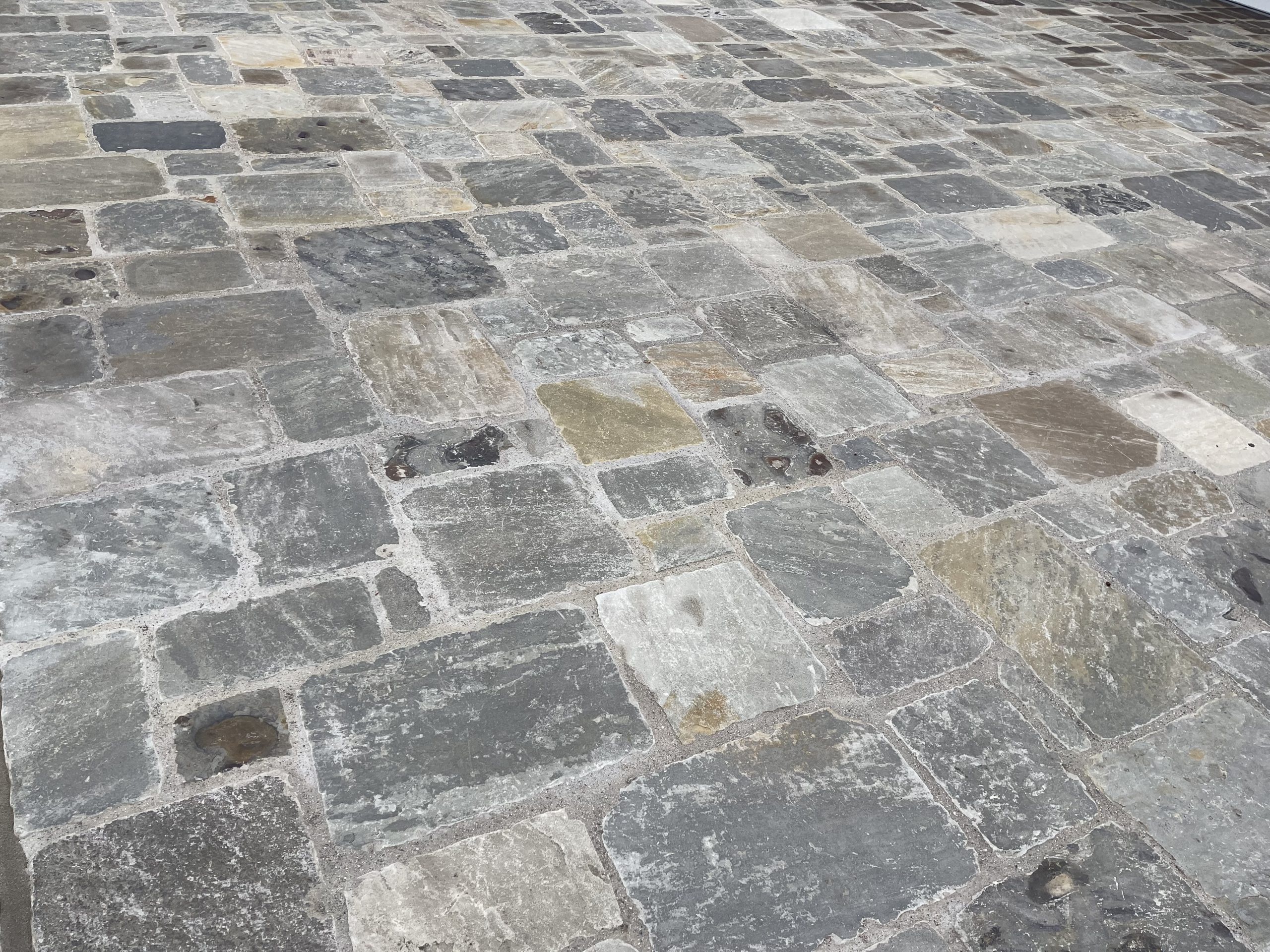 Autumn Breeze pavers installed as decorative ribbons in a concrete driveway